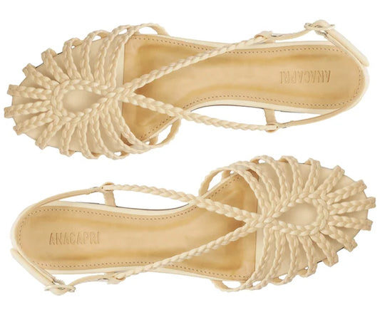 Flat sandal with braided straps, white teardrop shape.